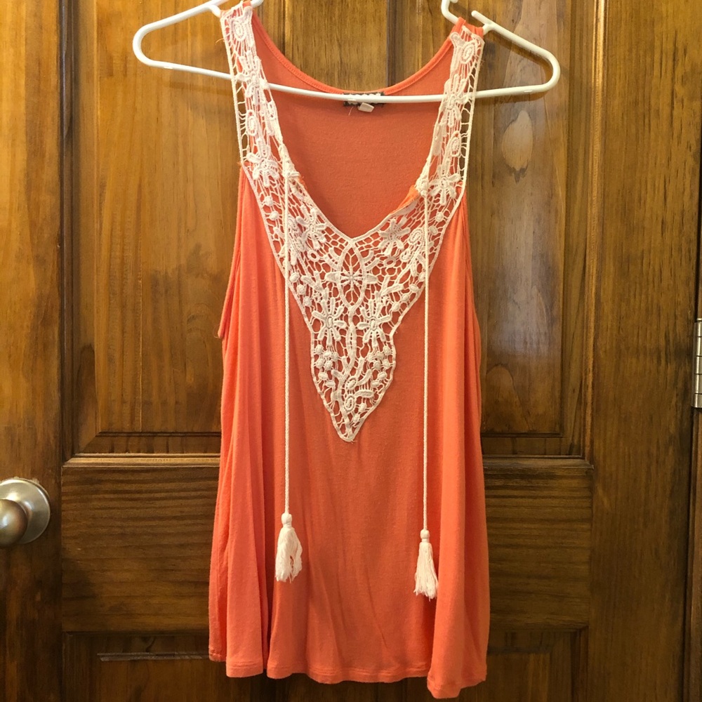 Tank top with a lacy front and tassels